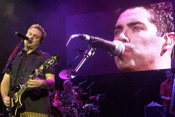 Steven Page co-lead singer for the Barenaked Ladies performs with the group in front of their large video screen Wednesday night, at the Marcus Amphiteater. (Photo: Jack Orton)