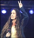 Alanis flashes a peace sign during Music Without Borders show last night. — Ernest Doroszuk, SUN 